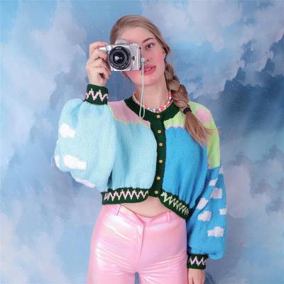 China Breathable Casual Sweater For Women Spliced Opposite Color Fashion Single Breasted Button Knit With Tied Lantern Sleeves for sale