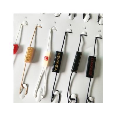 China Hot Selling Sustainable Custom Design Garment Garment Label Plastic Seal String Hang Tag for sale