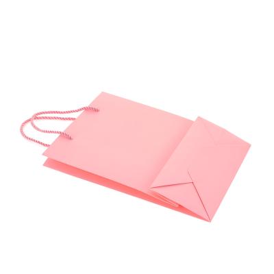 China High Speed Recycled Materials Logo Printed Fashion Cosmetics Luxury Paper Bag Custom Gift Bag for sale