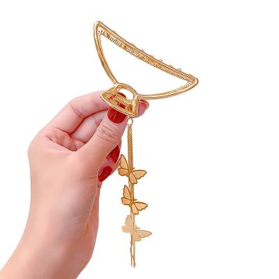 China Eco friendly hair claw Mengxin custom flower silver metal heart butterfly tassel big size rhinestone claws hair clips claw with tassle women bear for sale