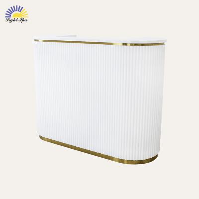 China Modern Luxury LightSpa custom made gold artificial stone solid surface semi circle beauty salon reception counter desk for sale