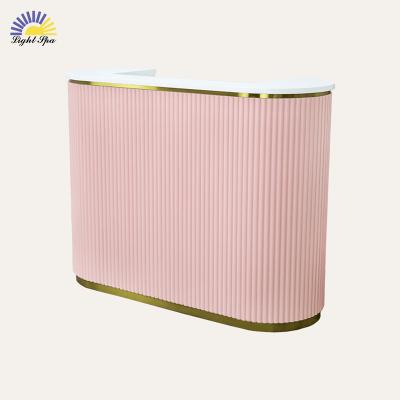 China Modern Luxury LightSpa Modern luxury pink beauty salon spa wooden reception desk gold stainless steel frame front desk reception counter for sale