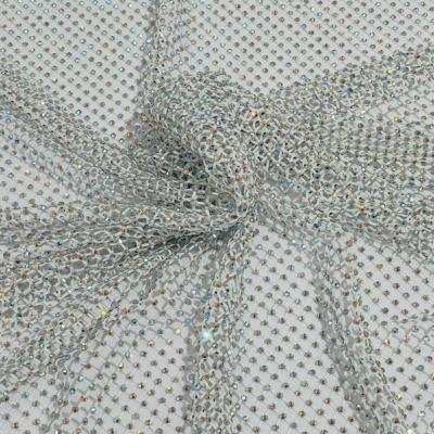 China Shinning Red Iridescent Rhinestones AB Fabric On Black Stretch Net Fabric Spandex Fish Net With Crystal Stones Sold By The Yard for sale