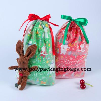 China Sacos 0.075mm plásticos excelentes do presente do Natal do cordão à venda