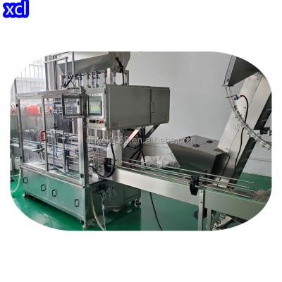 China Small Scale Manufacturing Semi Automatic Aerosol Filling Machines Spray Filling Packing Machine for sale