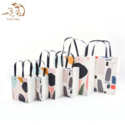 China Quality Recyclable Reliable Colors Printed AI Gift Paper Bag Customized Offset Printing Hand Length Handle Easy Open And Carry Accept for sale