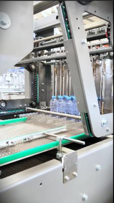 Chine 22 packs per minute film packing machine for bottled water production line exported to Saudi Arabia à vendre