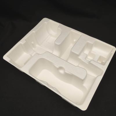 China Los fabricantes de OEM personalizan las bases de embalaje moldeadas en pulpa para pistolas de fascia de pequeños electrodomésticos. en venta