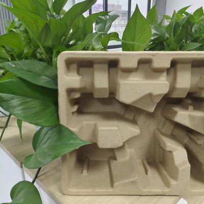 China La fábrica de moldeado de celulosa suministra directamente una base de embalaje respetuosa con el medio ambiente para el pequeño electrodoméstico, el vaporador de ropa de mano. en venta