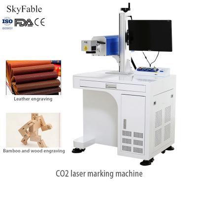 China 1064nm Carbon Dioxide Laser Marking Machine For Wood Leather Plastic Permanent Engraving for sale