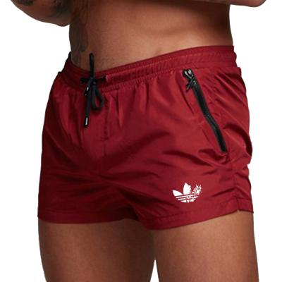 China QUICK DRY beach pants men's waterproof board shorts casual training swim trunksHot sale empty products shorts for sale