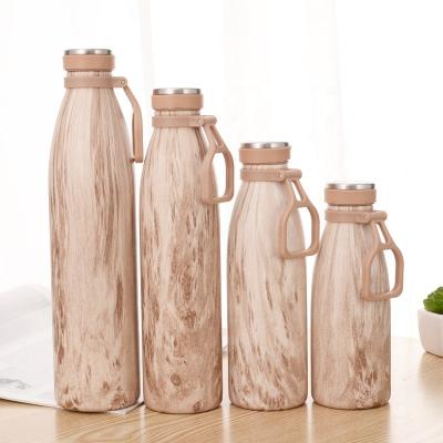 China Business Double Wall 304 Stainless Steel Cola Shape Bottle Vacuum Flasks With Handle for sale