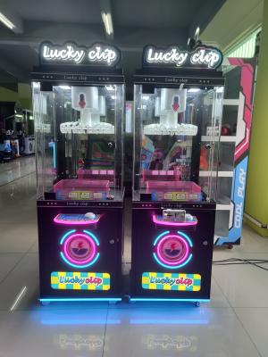 China Brazil popular arcade clip mini machine lucky clip prize machine 24 clips coin operated vending machine for sale