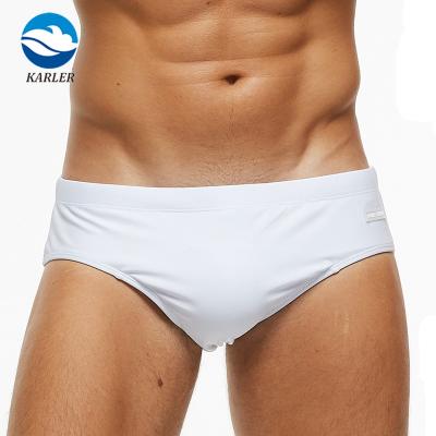 China Custom Made Anti-UV Mens Swimwear Briefs Solid White Bikini Swimwear Suit For Men Fits Men's Swim Briefs for sale