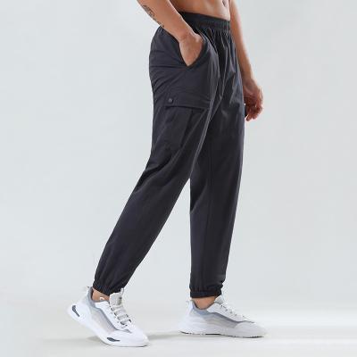 China Breathable Mens Gym Use Basketball Running Training Pants For Gym Wear Stretch Sportswer Pants Loose Trousers Joggerswith Pocket for sale