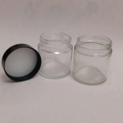 China Custom Food 1oz 2oz 3oz 4oz Child Proof Glass Jar Container With Cctv Cap/Lid for sale