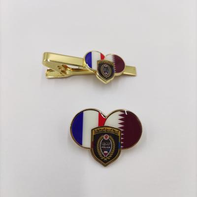 China Custom Tournament Security Force Badge – Premium Heart-Shaped Dual Flag Enamel Pin and Tie Clip Set for sale
