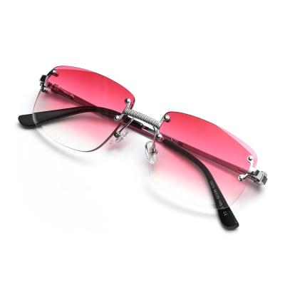 China Fashion Sunglasses 2021 New Fashion Vintage Women Metal Frameless UV400 Sunglasses for sale