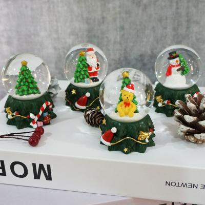 China Clear Promotion Giftts Christmas Decoration 4 Style Water Globe Resin Snow Globes for sale