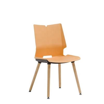 China Simple Nordic Modern White Warm Living Room Furniture PP Plastic Dining Chair With Soft Wooden Leg Cushion for sale