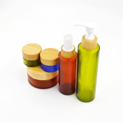 China Personal Care 15ml 50ml Frosted Glass Cosmetic Jar With Bamboo Lid Packaging for sale