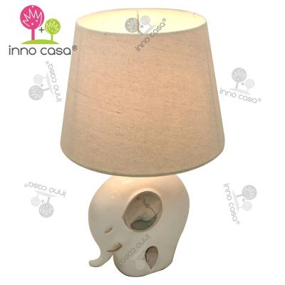 China Novelty Ceramic Porcelain Fabric Shade Elephant Kids Base Table Lamp With Silver Plating Children Decorative Light for sale
