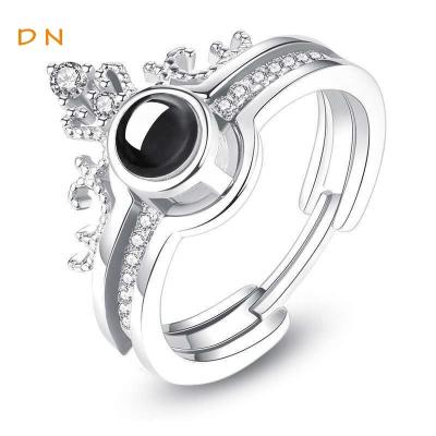 China Dina Fashion Customized Romantic Photo 100 Languages Wedding Crystal Crown Open Rings Projection Jewelry Women Engagement Set for sale