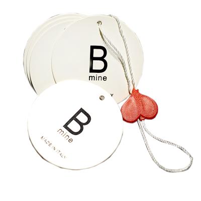 China Sustainable Newspaper Distribution Tour Circle Jewelry Swing Tags Custom With Hang Tag Plastic Heart Shaped Joint Elastic String Loop for sale