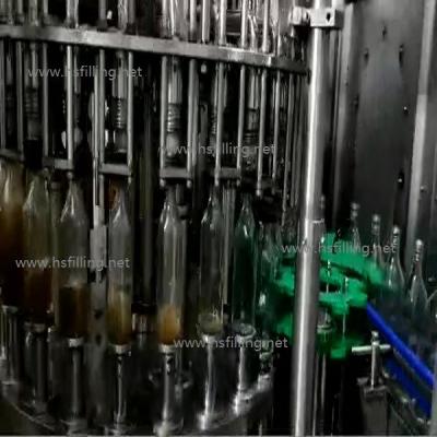 China CE de acero inoxidable de la máquina de la botella que capsula de cristal de la bebida alcohólica del relleno en caliente del casquillo automático de la máquina ROPP en venta