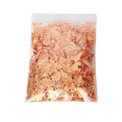 China Gold Leaf Flakes 24K Edible Sheets Food Sheet For Facial Gilding Cosmetics Resin Cake Deco Gold Leaves Color Foil Flakes for sale
