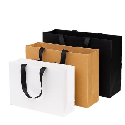 China Recyclable Luxury Gift Christmas Paper Bag Recyclable Custom Logo Clothing Shopping with Cotton Rope Handle Black Kraft Packaging Bags for sale