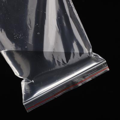 China Moisture Proof Waterproof Clear Transparent PE Zip lock Bag Red Side Zipper Pouches Ziplock Bags for sale