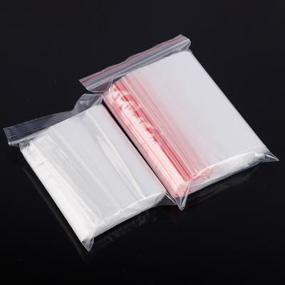 China Moisture Proof Custom Design Resealable Double Bone Transparent Clear Clothing Packaging PE Plastic Sealed Zipper Bag for sale