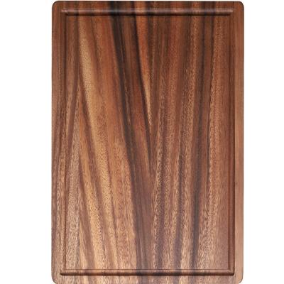 China Sustainable Acacia Wood Cutting Board Solid Wood Slotted Steak Dish Chopper for sale
