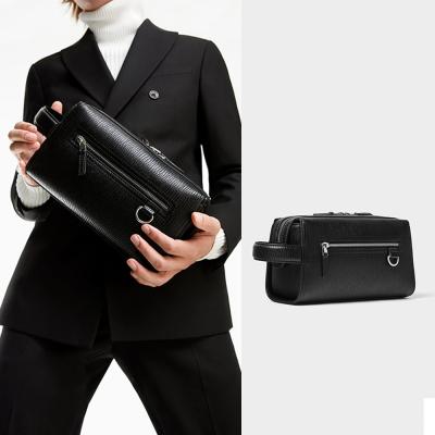 China Custom Logo Embossed Leather Men's Toiletry Bag Wash Bag Zipper Travel Pouch LeatherToiletry Shaving Dopp Kit For Men for sale