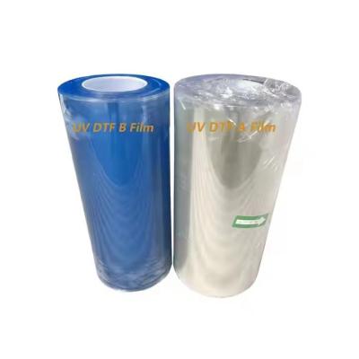 China Cold Hot Peel Ab A3 UV DTF Pet Film Roll Transparante DTF Transfer Film 60cm Op maat Te koop