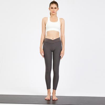 China Yoga Clothes 50% Spandex 50% Nylon Blended Ladies Workout Fit Pants And Tops for sale