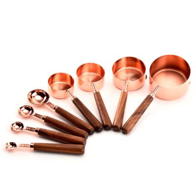 China Cooking Drink Measuring Cup Stainless Steel With Wooden Handle Cooking Measuring Cup for sale