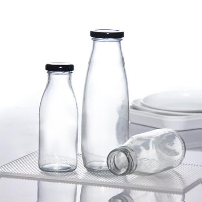 China OEM 250 ml 500 ml 1000 ml 2 litros Garrafas de vidro de leite Jar Grade Food Forma redonda à venda