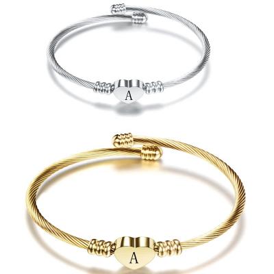 China High Quality 26 Letter Titanium Steel Bangle Stainless Steel Love Open Bangle For Women Laser Logo Marking for sale