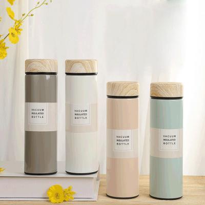 China Flypeak new sustainable 304 stainless steel water bottle vacuum insulated retro portable flask termos water bottle with wood grain lid for sale