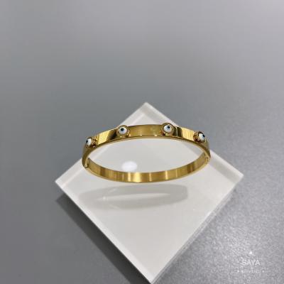 中国 党18K金のステンレス鋼の腕輪の青い目セットのバックルのブレスレット 販売のため