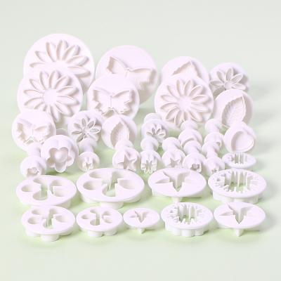 China EC018 Sustainable Baking Tools Spring Plastic Cookie Mold 10 Models 33 Piece Set Fondant Cake Tool Kit for sale