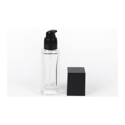 China 15ml 20ml 30ml 40ml Eco-friendly Recyclable Wholesale Cosmetic Square Lotion Base Lotion Base Glass Clear Empty Bottle With Pump for sale