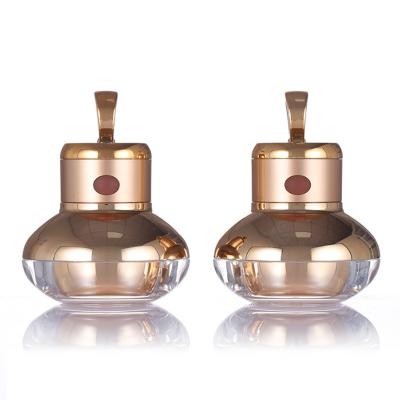 Chine Bouteille d'or de crème de soins de la peau d'OEM autour de la bouteille en plastique 30g de crème de vibration à vendre