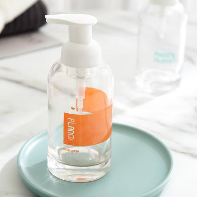China Personal Care Hand Sanitizer Shampoo Body Lotion 350ml Round Hand Clear Glass Soap Foaming Bottle for sale