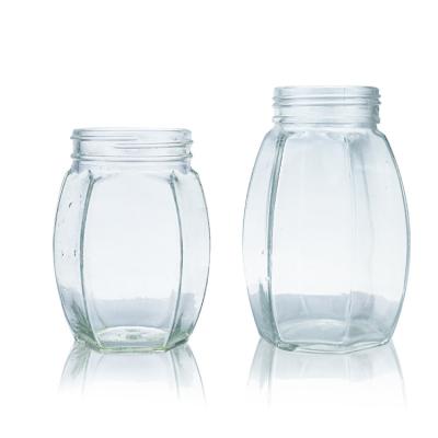 China Hexagonal Glass Storage 300ml 680ml Clear Honey Jar With Metal Screw Lid for sale