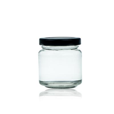 China Storage 100ml Round Glass Honey Jam Bottle With Black Lid for sale