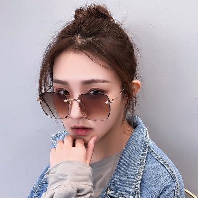 China Fashion Sunglasses 2020 New Arrivals Rimless Glass Ladies Sunny Trendy Sunglasses for sale