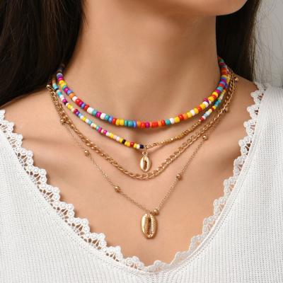 China TRENDY Bohemian Fashion Gold Shell Metal Clavicle Chain Colorful Creative Rice Bead Multilayer Necklace Accessories For Women for sale